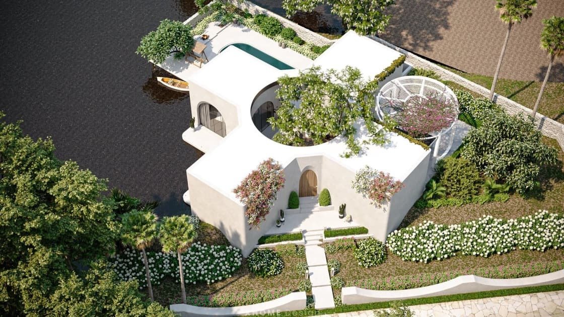 Ngôi nhà thiết kế hình cây thánh giá với vườn cây xanh mát và hồ bơi cạnh sông.