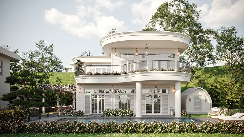 Biệt thự hiện đại hai tầng với ban công rộng, sân vườn xanh và hồ bơi nhỏ, tạo không gian sống thoải mái.