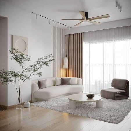 Phòng khách hiện đại với sofa trắng, bàn tròn, cây xanh, và cửa sổ rộng mang ánh sáng tự nhiên.