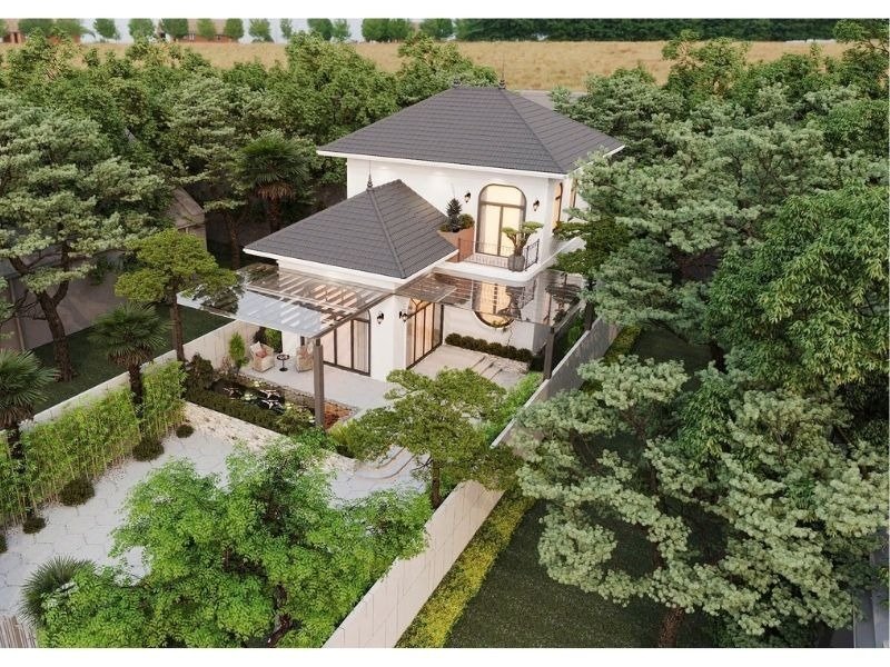 Biệt thự hai tầng hiện đại giữa rừng cây xanh, với sân vườn rộng và nội thất sang trọng.