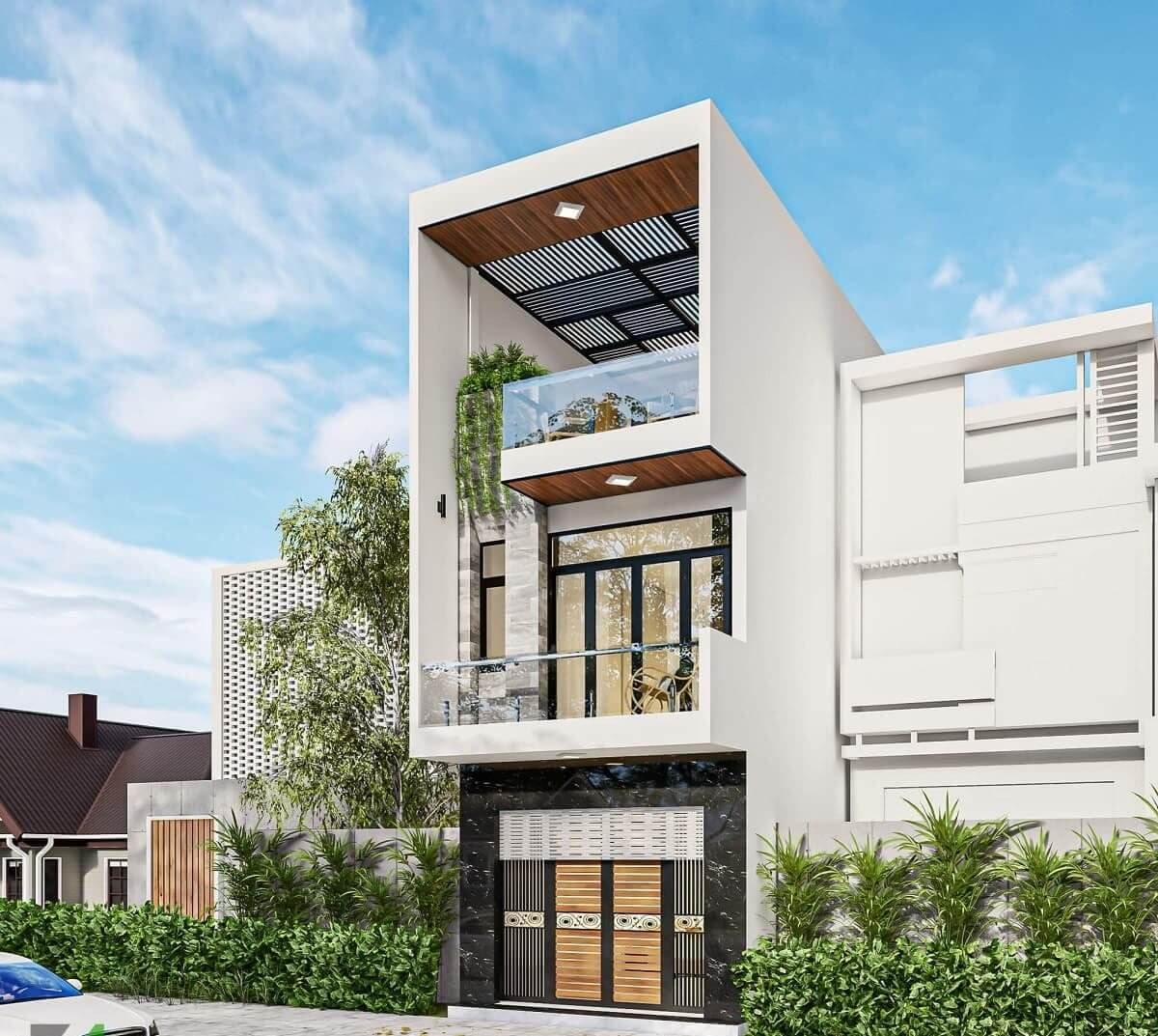 mau-nha-pho-mat-tien-6m-3-tang-dai-18m-2-1 Nhà phố hiện đại 3 tầng với ban công kính, cây xanh, thiết kế tối giản và sáng sủa, bầu trời xanh.