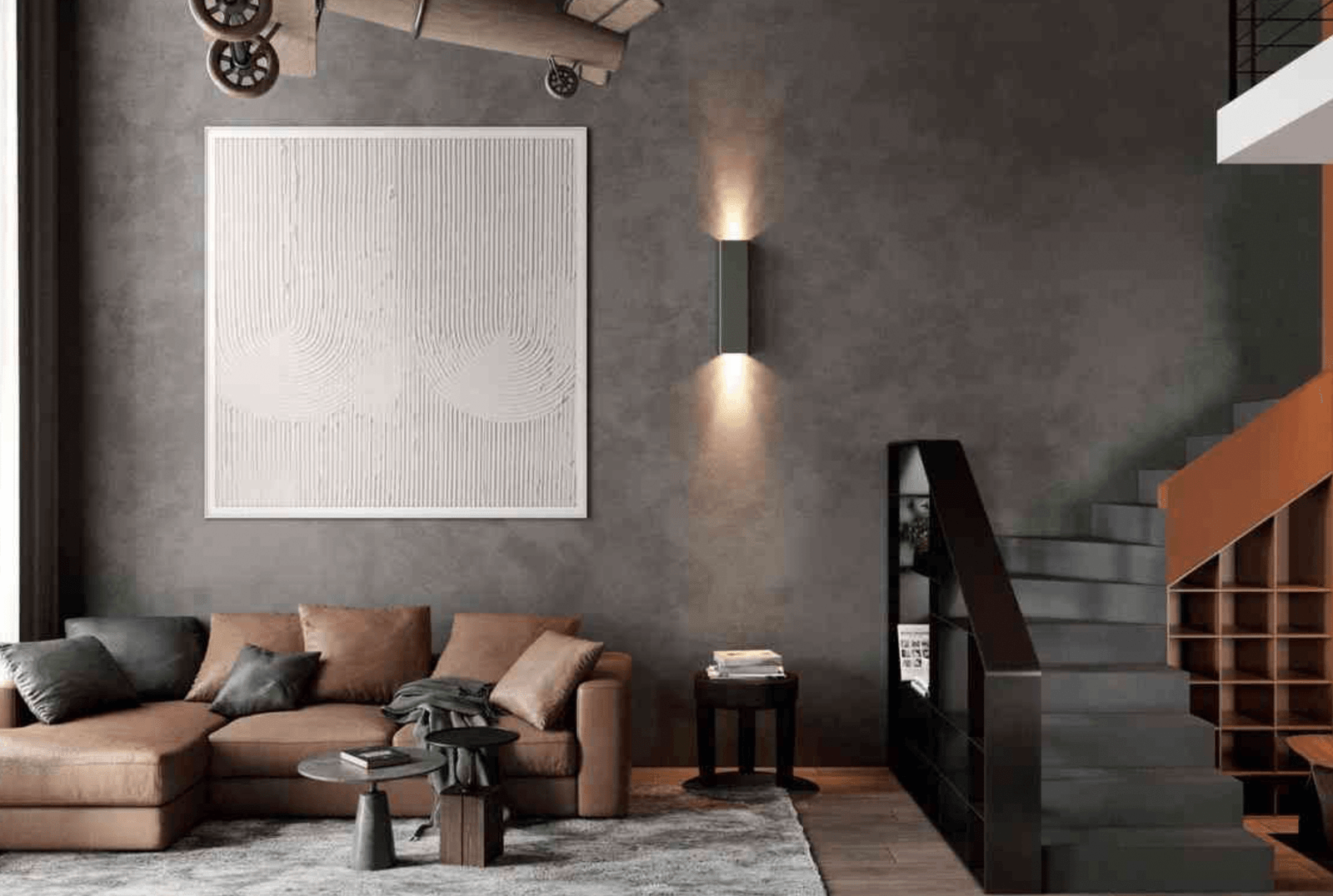 Phòng khách hiện đại với sofa da nâu, tranh treo tường, cầu thang gỗ và bàn cafe phong cách tối giản.