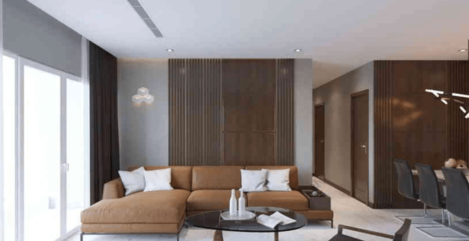 Phòng khách hiện đại với sofa nâu, bàn tròn và tường gỗ, cửa kính lớn mang lại ánh sáng tự nhiên.