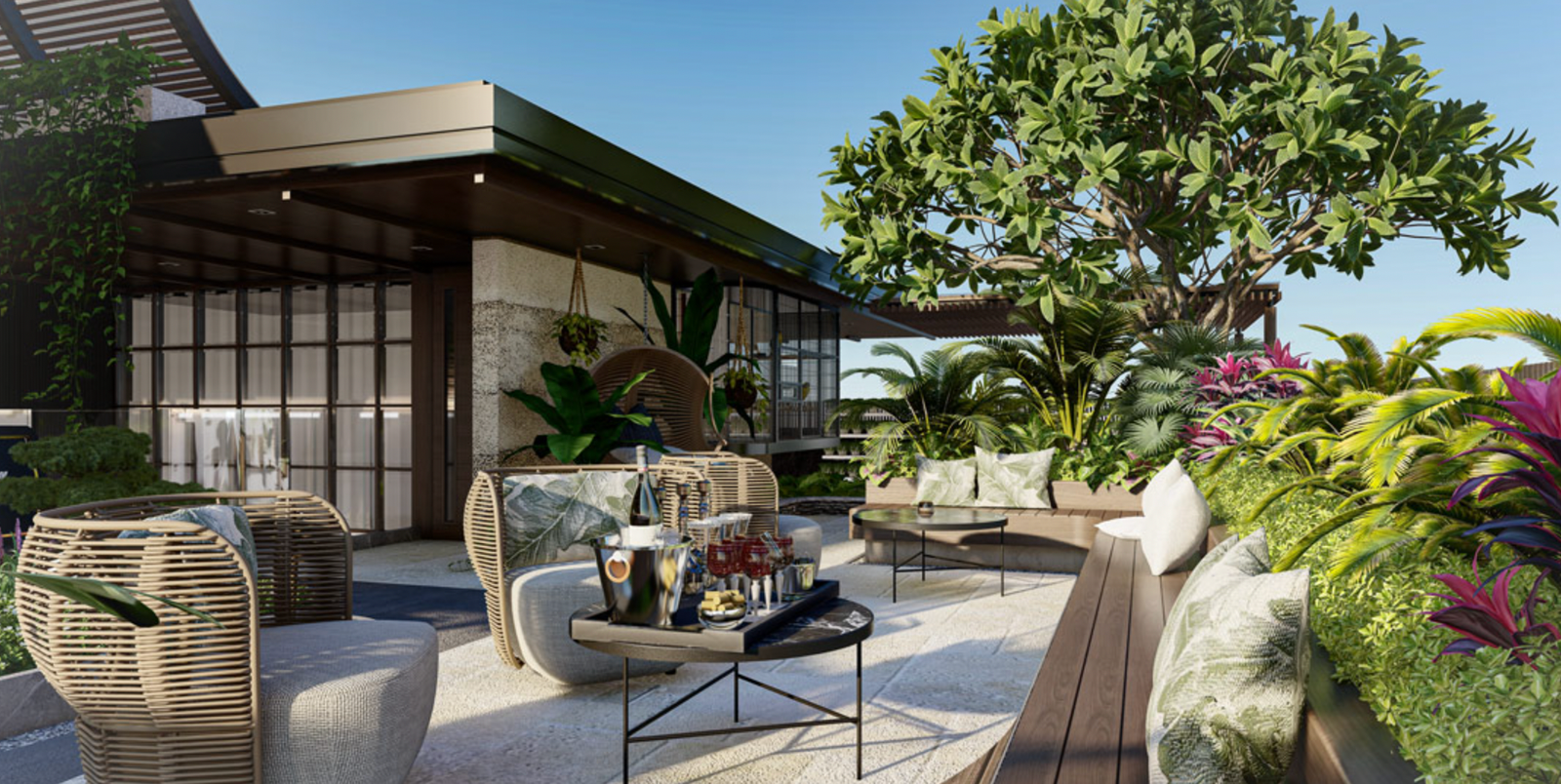 Khu vực sân vườn xanh mát với ghế mây, bàn trà, cây cối rực rỡ bên cạnh căn nhà hiện đại.