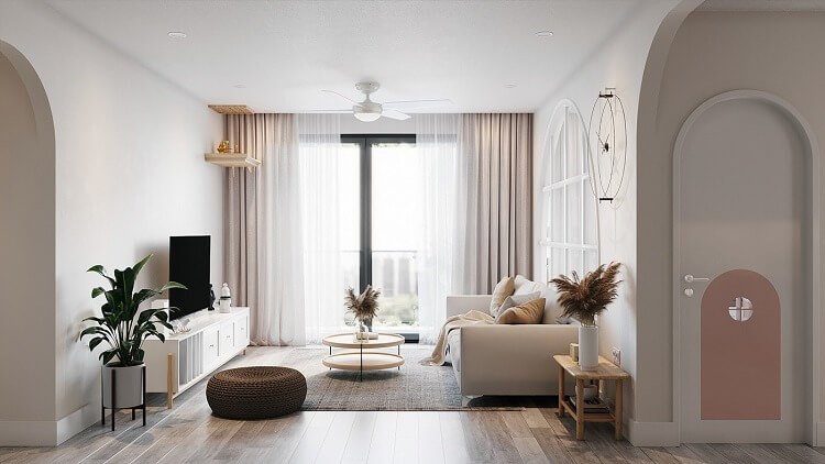 Phòng khách hiện đại với sofa trắng, cửa sổ lớn và cây xanh trang trí, tạo không gian thoáng đãng và sáng sủa.