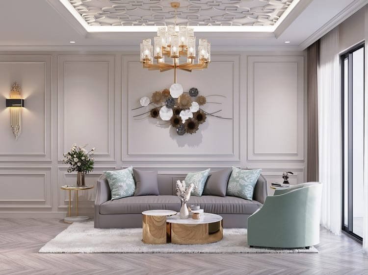 Phòng khách sang trọng với sofa xám, đèn chùm, décor tường và bàn cafe hiện đại.