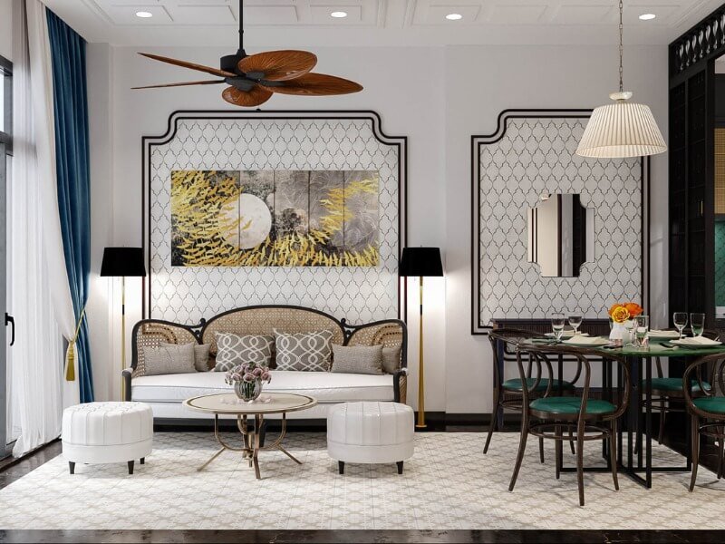 Phòng khách sang trọng với nội thất hiện đại, bàn tròn nhỏ, đèn trần, và tranh treo tường nghệ thuật.