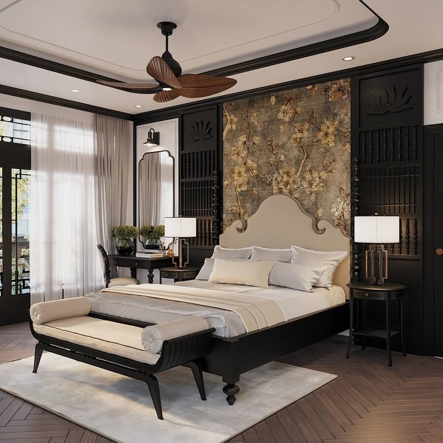 Phòng ngủ sang trọng với giường lớn, decor hoa văn, đèn treo trần và cửa sổ nhìn ra ngoài trời.